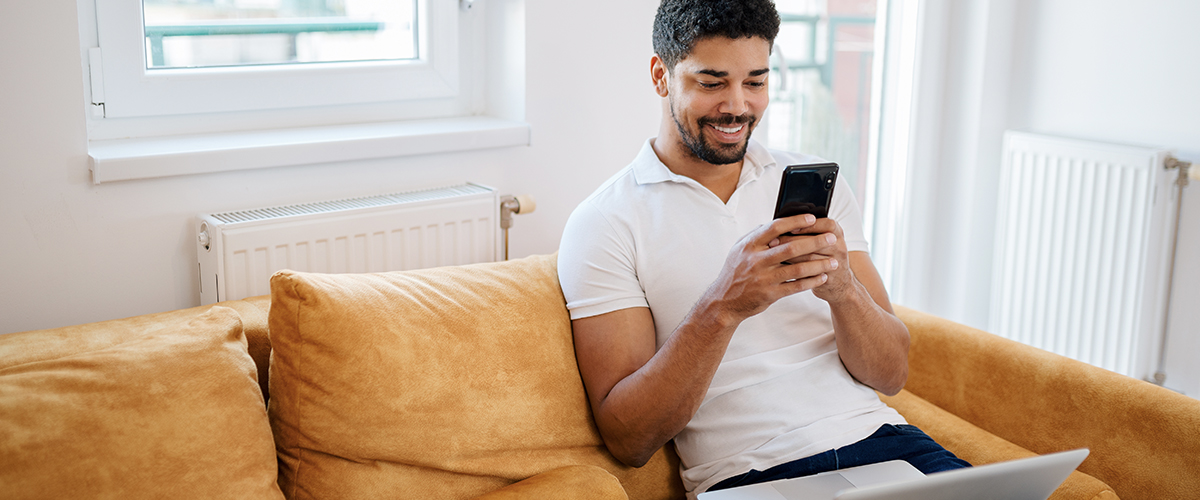 man on phone studying level 2 accountancy online learning