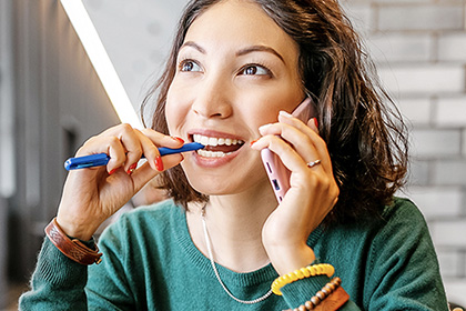 woman-on-phone-studying-aat-level-2-accounting-mobile